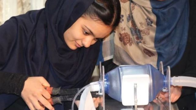 An "Afghan Dreamer" is seen assembling a respirator