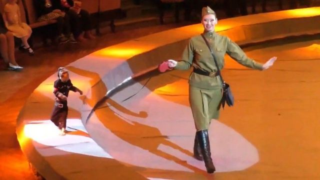 A monkey in a Nazi costume at a circus show