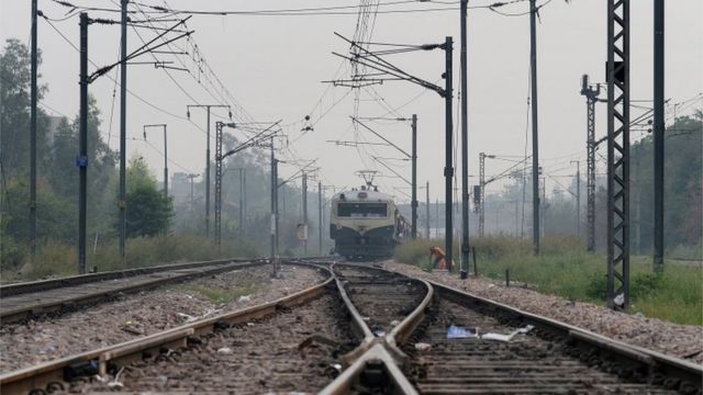 An Indian Railways passenger train travels on a railway track in New Delhi on November 10, 2015.