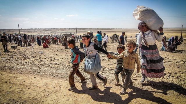 Syrians fleeing the war towards the Turkish border. September 2014