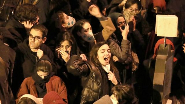 Iranian students chant slogans as they demonstrate