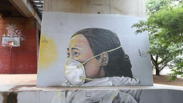 A mural of Ai Fen, one of the first doctors to raise the alarm about COVID-19