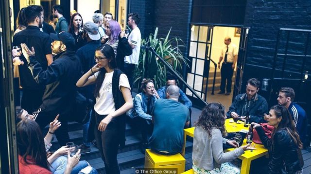 Workers gather for drinks at a co-working space run by The Office Group near London's Oxford Street