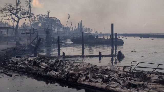 A charred boat lies in the scorched waterfront after wildfires fanned by the winds of a distant hurricane devastated Maui's city of Lahaina, Hawaii, U.S. August 9, 2023.