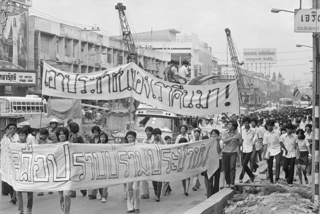 Youthful anti-government students march toward Bangkok's Thammasart University August 7. The demonstration is similar to that which brought down the military government of Field Marshall Thanom Kittikachorn in October 1973. They are carrying banners with slogans reading "You must return my people to me," referring to arrested students.
