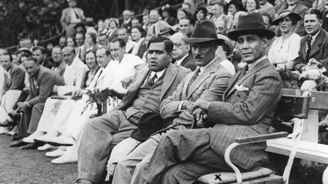 circa 1950: Sir Hamidullah Khan (1894 - 1960), the Nawab of Bhopal (right), sitting with Mr Haider and Colonel Hughdensville, watching an exhibition tennis match given in his honour. (Photo by Hulton Archive/Getty Images)