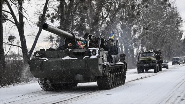 Ukrainian tank rolls along a main road on 8 March 2022