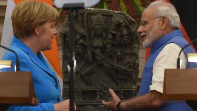 angela merkel signs key business deal with india s narendra modi bbc news