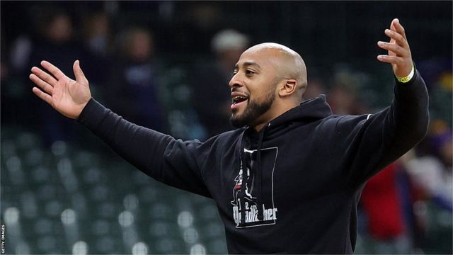 AJ Dillon attempts Lambeau Leap during Man City-Bayern soccer game