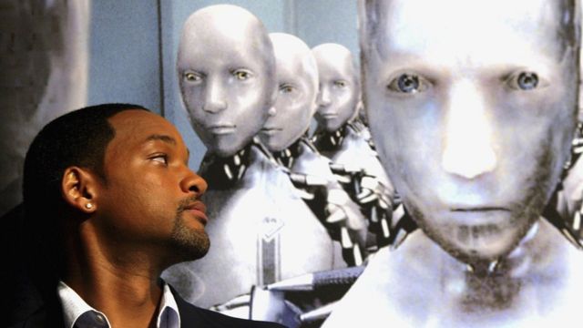 Actor Will Smith looking at images of ‘android’ robots during a press launch for ‘I, Robot’ on 7 September 2004 in Tokyo, Japan