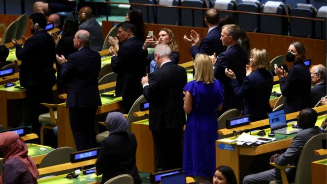 UN delegates stand and applaud President Zelensky's video address