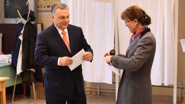 Viktor Orban and his wife Aniko Levai vote in the Sunday election