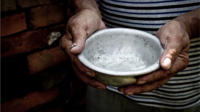 Woman holds empty bowl