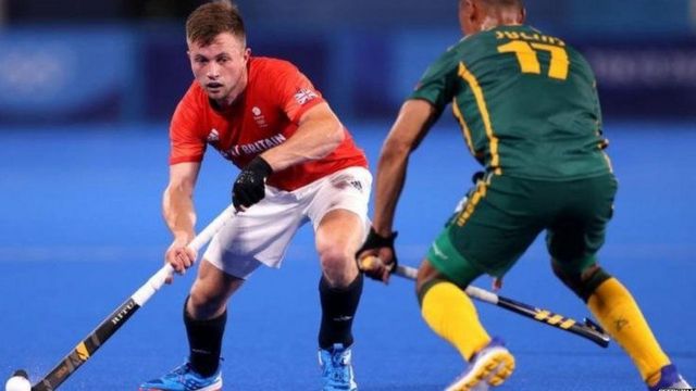 British player Jack Wallace tries to stop the ball from the opponent