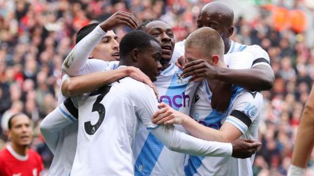 Eberechi Eze celebrates with Crystal Palace teammates after his goal against Liverpool at Anfield