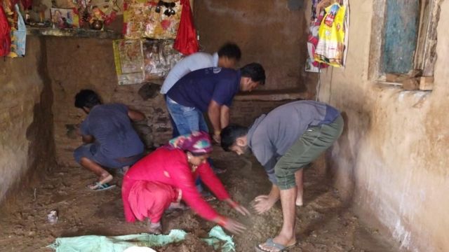 A family tries to seal the cracks in their house with mud