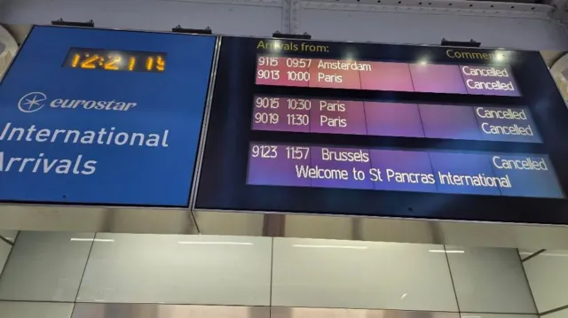 Departure boards at St Pancras station showing Eurostar service cancellations