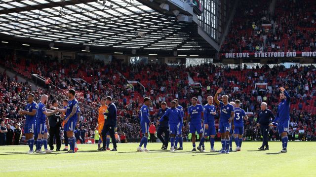 Cardiff City players celebrate at Old Trafford after beating Manchester United