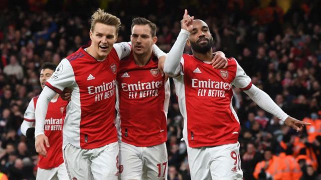 Arsenal players Martin Odegaard, Cedric Soares and Alexandre Lacazette celebrate