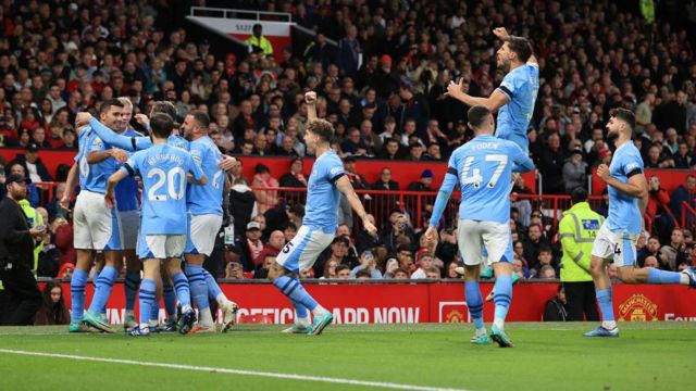 Manchester City players celebratee at Old Trafford