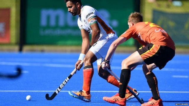 Harmin Preet Singh takes the ball away from the opponent