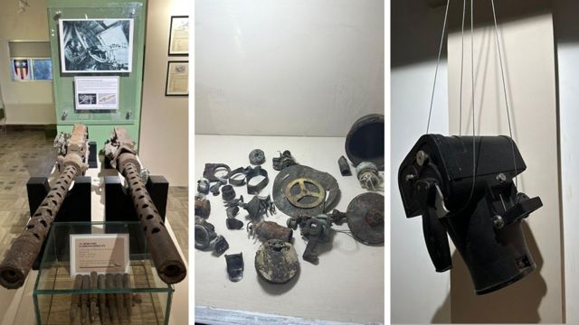 Uma metralhadora, pedaços de destroços, uma câmera: alguns dos artefatos recuperados no museu recém-inaugurado