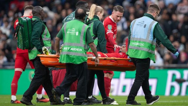 Jarrell Quansah goes off injured on a stretcher