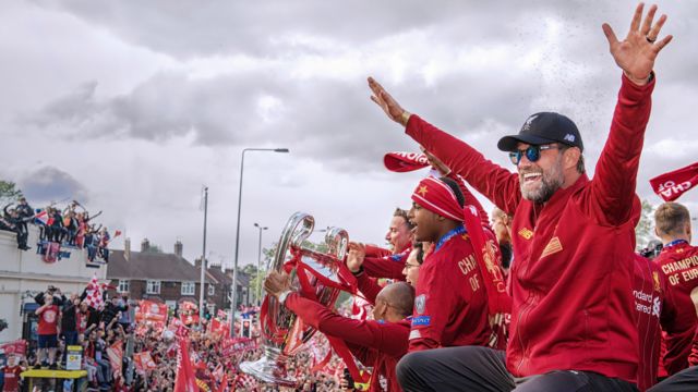 Jurgen Klopp salutes the crowd during Liverpool's bus parade after winning the 2019 Champions League