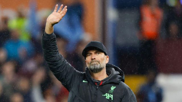 Jurgen Klopp the head coach / manager of Liverpool waves to Liverpool fans at full time after the Premier League match between Aston Villa and Liverpool FC at Villa Park