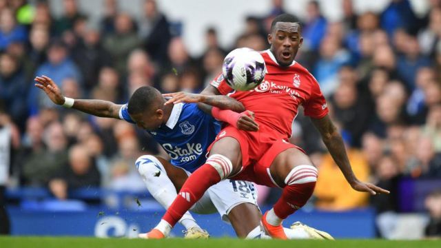 Nottingham Forest's Callum Hudson-Odoi is tackled by Everton's Ashley Young during the Premier League match between Everton FC and Nottingham Forest at Goodison Park