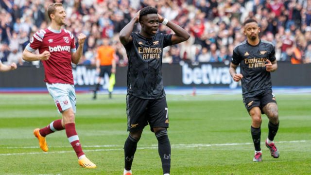 Bukayo Saka reacts to missing a penalty