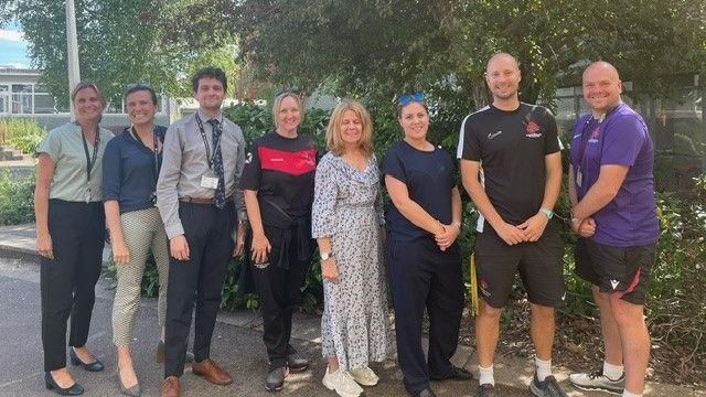 Gareth (right) with some school staff members from the walking team