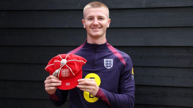 Adam Wharton with his England debut cap