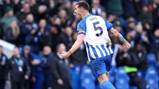 Brighton defender Lewis Dunk celebrates his stoppage-time equaliser against Everton