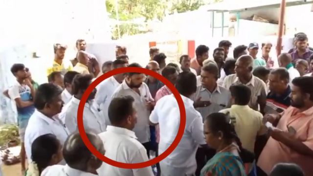 விவசாயியை காலால் உதைத்த அதிகாரி