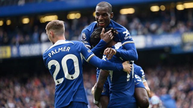 Chelsea players celebrate scoring against West Ham