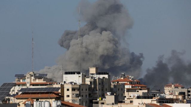 A plume of smoke follows an Israeli airstrike in the northern part of the Gaza Strip