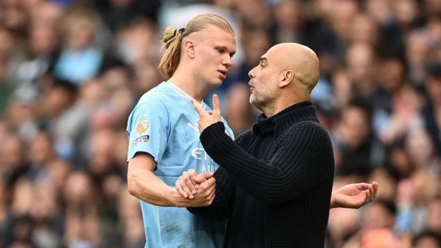 Pep Guardiola, Manager of Manchester City, and his player, Erling Haaland clash upon his substitution