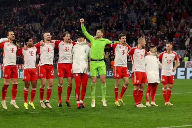 Bayern Munich players lock arms to celebrate victory over Lazio