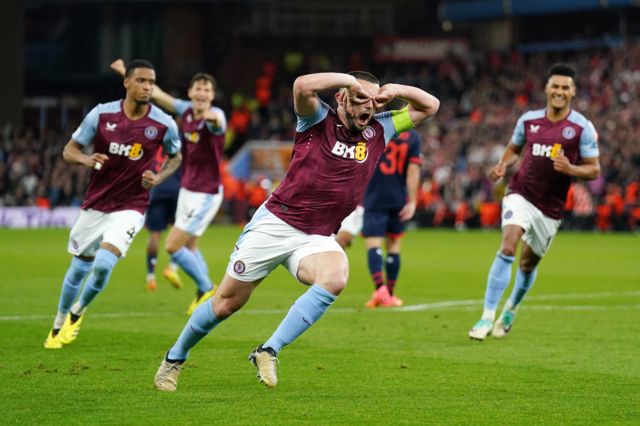 John McGinn celebrates scoring for Aston Villa against Lille