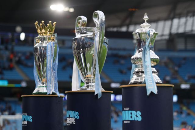 The Premier League, Champions League and FA Cup trophies at Etihad Stadium
