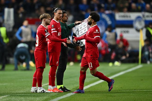 Mohamed Salah of Liverpool leaves the pitch after being substituted as Harvey Elliott and Darwin Nunez