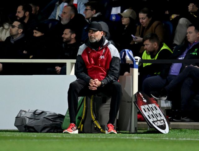 Jurgen Klopp looks disconsolate as he sits in the technical area during Liverpool's Europa League exit to Atalanta