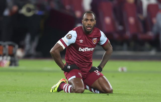 Michail Antonio slumps to his knees after West Ham are knocked out of their Europa League quarter-final by Bayer Leverkusen