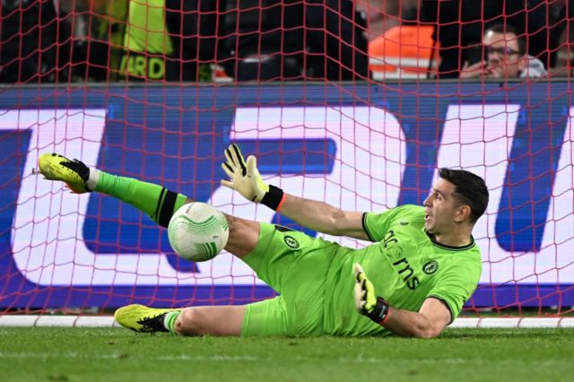 Aston Villa goalkeeper Emiliano Martínez saves a penalty in their shootout win over Lille