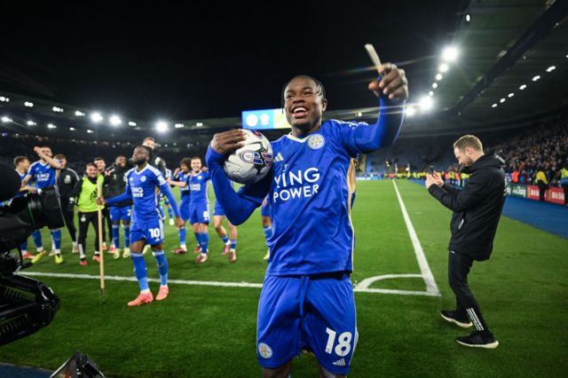 Abdul Fatawu of Leicester City celebrates with the match ball following his hat-trick against Southampton