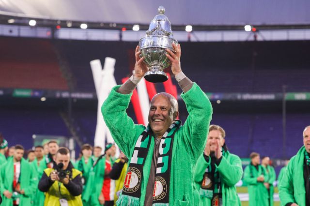 Feyenoord manager Arne Slot lifts the Eredivisie trophy