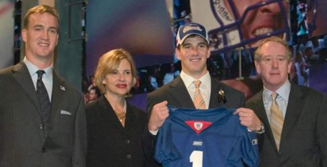 Eli Manning with a New York Giants jersey at the 2004 NFL draft