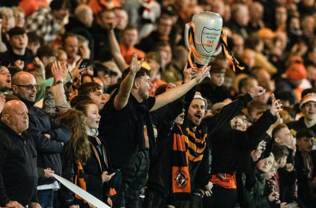 Dundee United fans during a cinch Championship match between Airdrionians and Dundee United at Excelsior Stadium, on April 26, 2024, in Airdrie, Scotland.