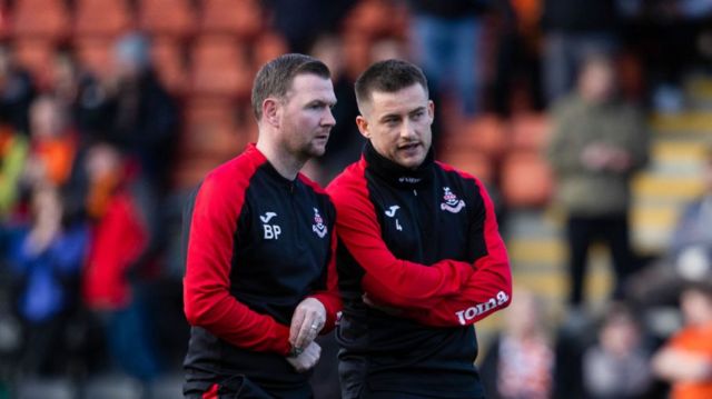 Airdrie Manager Rhys McCabe (R) and Coach Bryan Prunty during a cinch Championship match between Airdrionians and Dundee United at Excelsior Stadium, on April 26, 2024, in Airdrie, Scotland.